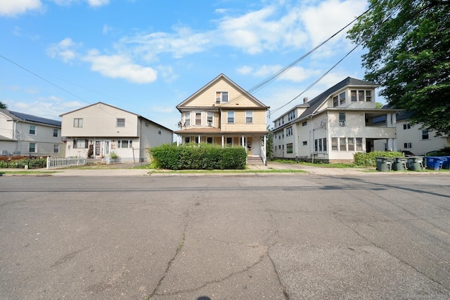 49 Dover St, Bridgeport, CT 06610 - view of front of property featuring covered porch and a residential view