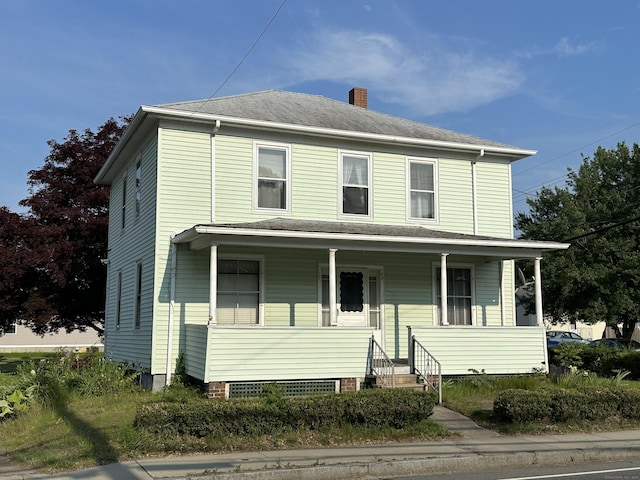 189 N Main St, Griswold, CT 06351 - view of front of home featuring a chimney and covered porch