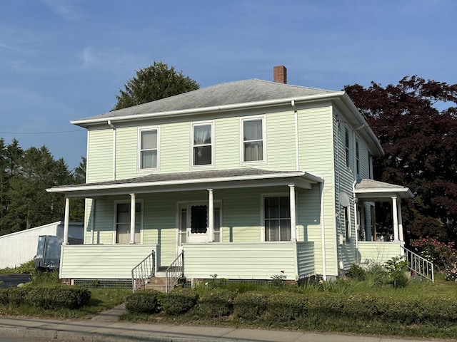 189 N Main St, Griswold, CT 06351 - view of front facade with a chimney and covered porch