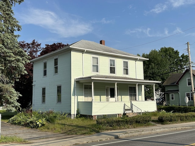 189 N Main St, Griswold, CT 06351 - view of front facade featuring a chimney and a porch