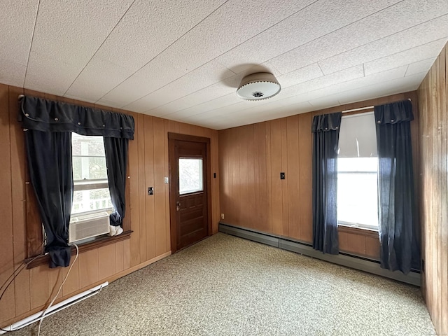 189 N Main St, Griswold, CT 06351 - foyer featuring a baseboard radiator, cooling unit, wooden walls, and a baseboard heating unit