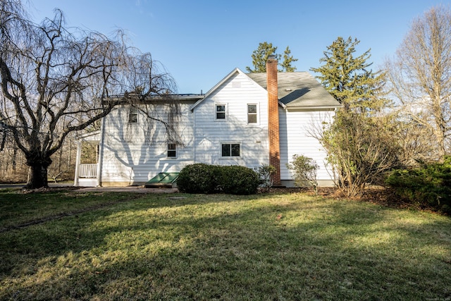 65 Spring St, Middlefield, CT 06481 - view of property exterior with a lawn and a chimney