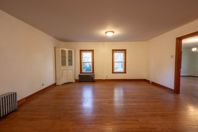 65 Spring St, Middlefield, CT 06481 - unfurnished room with radiator heating unit, dark wood finished floors, and baseboards