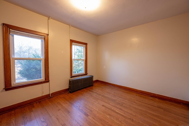 65 Spring St, Middlefield, CT 06481 - unfurnished room with radiator heating unit, light wood-style floors, and baseboards