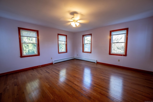 65 Spring St, Middlefield, CT 06481 - spare room with a ceiling fan, baseboard heating, dark wood-type flooring, and baseboards