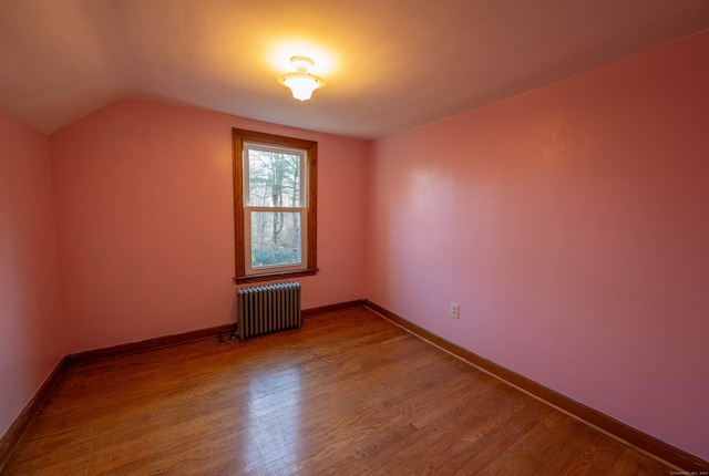 65 Spring St, Middlefield, CT 06481 - bonus room with radiator, wood finished floors, vaulted ceiling, and baseboards
