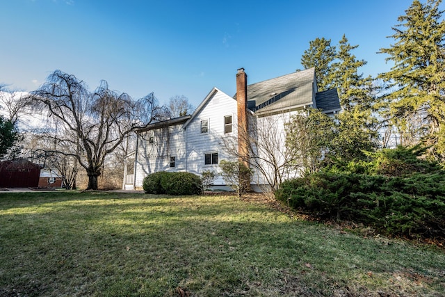 65 Spring St, Middlefield, CT 06481 - view of side of home featuring a lawn and a chimney