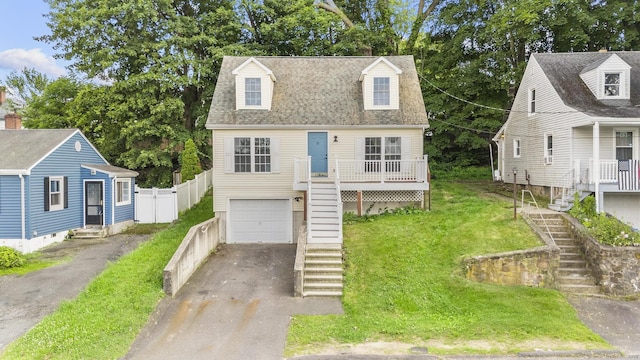 59 Colony St, Bristol, CT 06010 - cape cod home featuring stairway, asphalt driveway, a garage, and roof with shingles