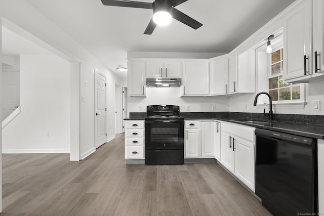 59 Colony St, Bristol, CT 06010 - kitchen with black appliances, under cabinet range hood, a ceiling fan, wood finished floors, and white cabinetry