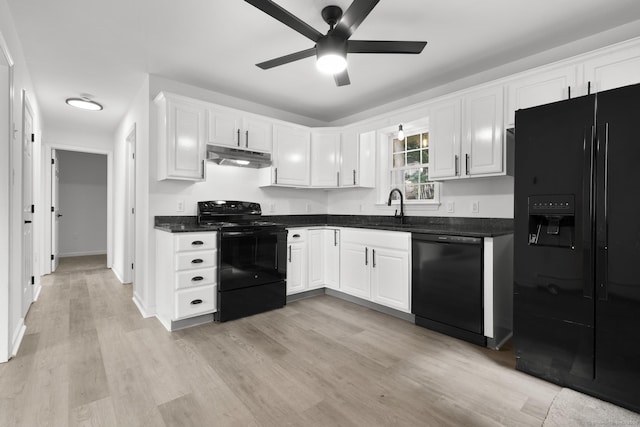 59 Colony St, Bristol, CT 06010 - kitchen with black appliances, under cabinet range hood, a ceiling fan, dark countertops, and white cabinetry