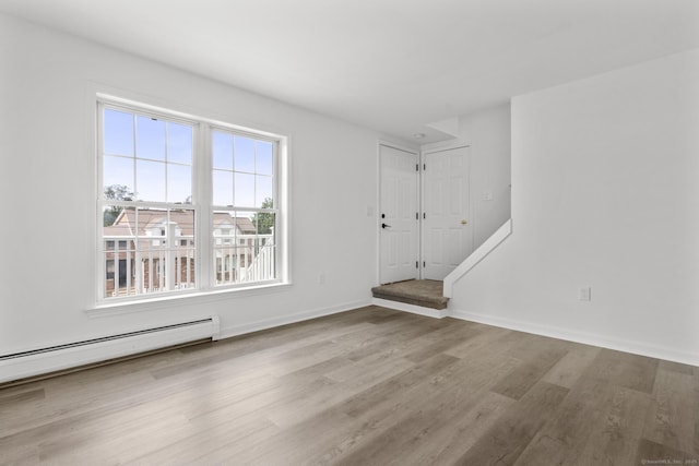 59 Colony St, Bristol, CT 06010 - foyer entrance featuring wood finished floors and a baseboard radiator