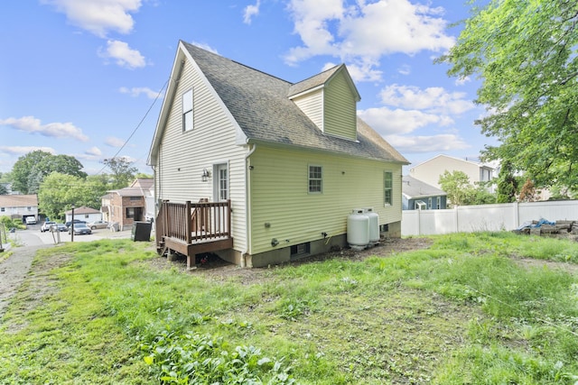 59 Colony St, Bristol, CT 06010 - rear view of house featuring roof with shingles and a deck