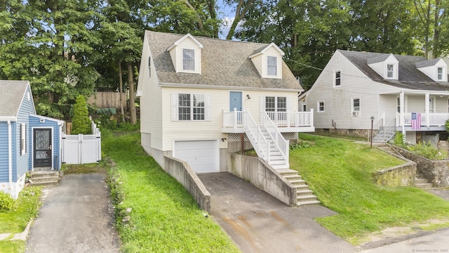 59 Colony St, Bristol, CT 06010 - cape cod house featuring stairs, driveway, a garage, and roof with shingles