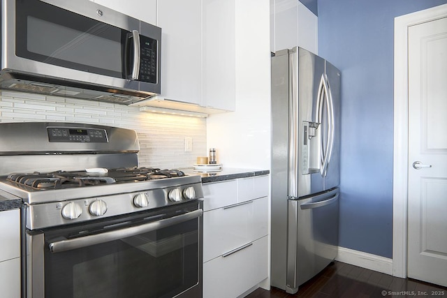 4 Daskams Ln Unit 303, Norwalk, CT 06851 - kitchen featuring appliances with stainless steel finishes, white cabinetry, decorative backsplash, modern cabinets, and dark wood finished floors