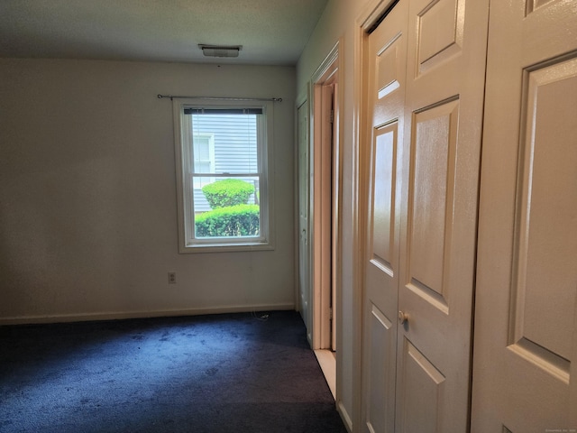 2415 Shepard Ave Apt 30, Hamden, CT 06518 - unfurnished bedroom featuring dark colored carpet and baseboards