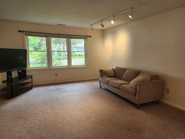 2415 Shepard Ave Apt 30, Hamden, CT 06518 - carpeted living area with plenty of natural light, baseboards, and track lighting