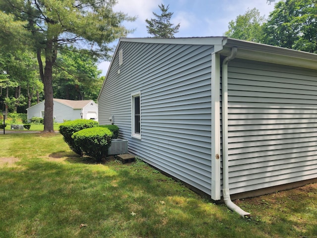 2415 Shepard Ave Apt 30, Hamden, CT 06518 - view of home's exterior with a lawn and central AC unit