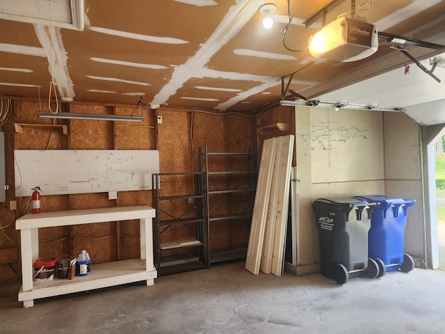 2415 Shepard Ave Apt 30, Hamden, CT 06518 - garage featuring a garage door opener and a workshop area