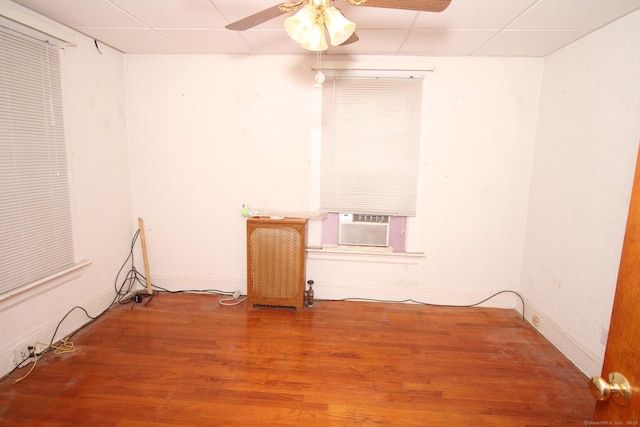 87 Hayden St, Windham, CT 06226 - spare room featuring ceiling fan, wood finished floors, a paneled ceiling, and cooling unit