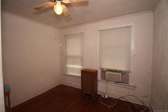 87 Hayden St, Windham, CT 06226 - spare room with wood finished floors, a ceiling fan, radiator heating unit, cooling unit, and crown molding