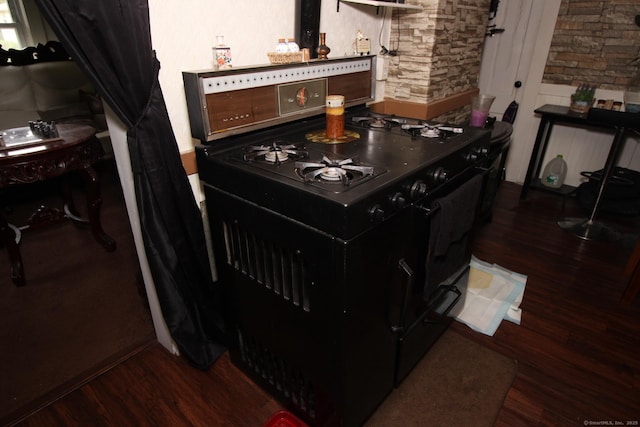 87 Hayden St, Windham, CT 06226 - kitchen featuring black gas stove and wood finished floors