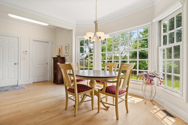 184 Stillson Rd Unit 184, Fairfield, CT 06825 - dining space with a chandelier, crown molding, and light wood-type flooring