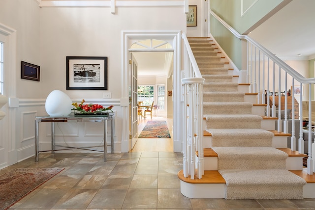 184 Stillson Rd Unit 184, Fairfield, CT 06825 - staircase featuring a decorative wall and wainscoting