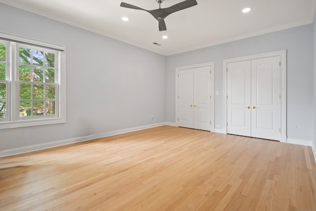184 Stillson Rd Unit 184, Fairfield, CT 06825 - unfurnished bedroom with multiple closets, ornamental molding, light wood-type flooring, baseboards, and recessed lighting