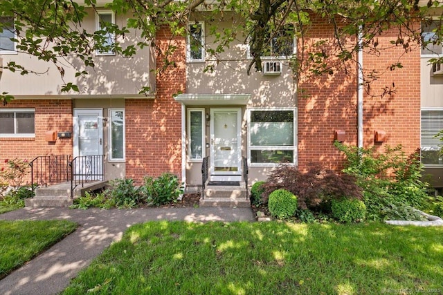 89 Centerbrook Rd, Hamden, CT 06518 - view of front facade with brick siding and a front lawn