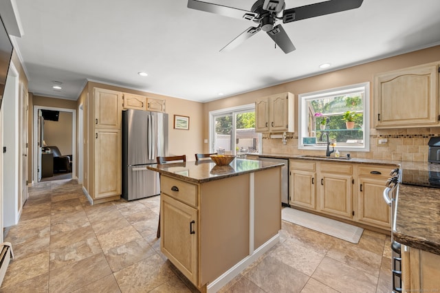 23 Lewis Rd, Preston, CT 06365 - kitchen featuring appliances with stainless steel finishes, light brown cabinets, a sink, dark stone counters, and recessed lighting
