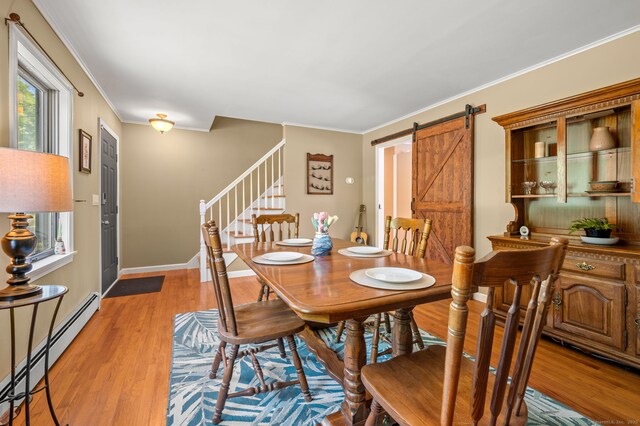 23 Lewis Rd, Preston, CT 06365 - dining room with a baseboard radiator, stairway, a barn door, crown molding, and light wood finished floors