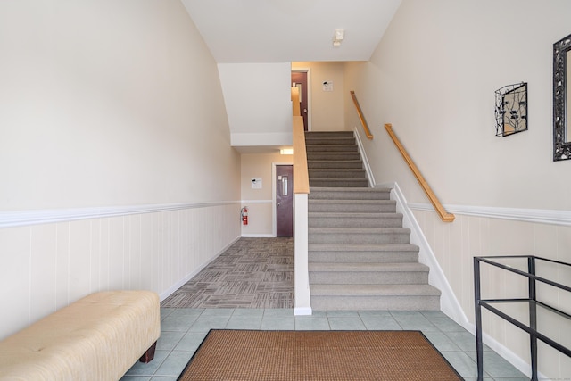 17 Fordyce Ct Apt 13, New Milford, CT 06776 - stairs with tile patterned floors and a wainscoted wall