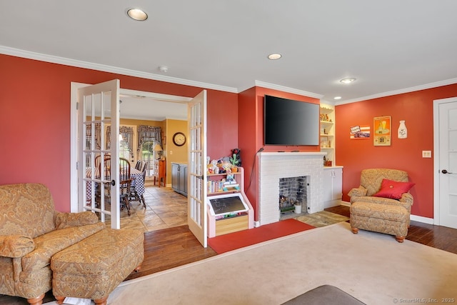 35 Summer St, Portland, CT 06480 - living area featuring wood finished floors, ornamental molding, recessed lighting, and a brick fireplace