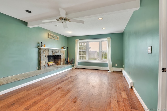 35 Summer St, Portland, CT 06480 - unfurnished living room with wood finished floors, a stone fireplace, a ceiling fan, recessed lighting, and baseboard heating