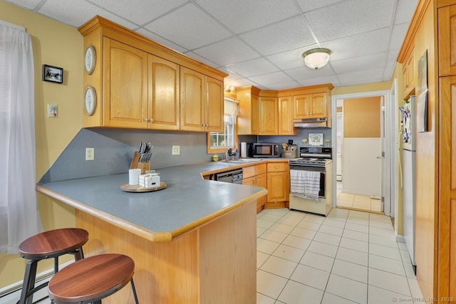 35 Summer St, Portland, CT 06480 - kitchen featuring gas range, under cabinet range hood, a peninsula, light tile patterned floors, and a paneled ceiling