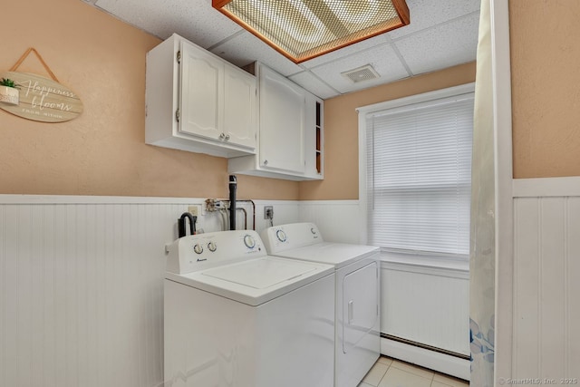 35 Summer St, Portland, CT 06480 - washroom with a baseboard radiator, cabinet space, washer and clothes dryer, a wainscoted wall, and light tile patterned floors