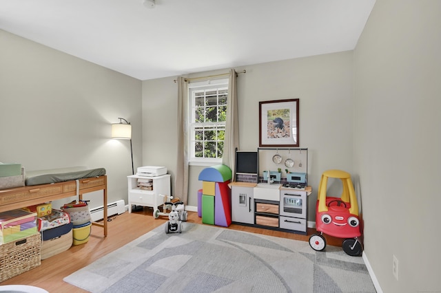 84 Wellman Rd, Manchester, CT 06040 - rec room with baseboard heating and wood finished floors