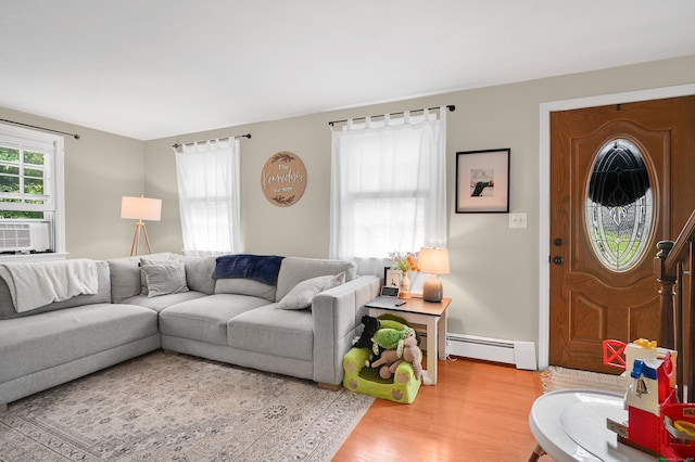 84 Wellman Rd, Manchester, CT 06040 - living room featuring a baseboard heating unit, wood finished floors, and cooling unit