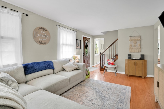 84 Wellman Rd, Manchester, CT 06040 - living area featuring light wood-style floors and stairs
