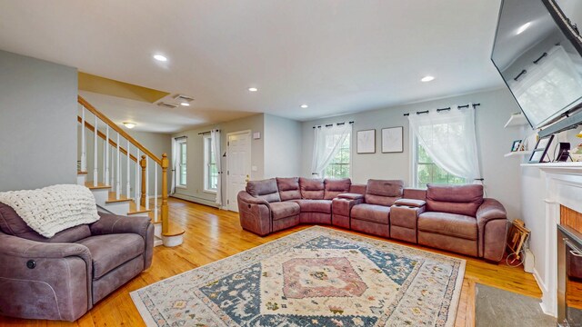 19 Heritage Brook Dr, East Haddam, CT 06423 - living room with stairs, light wood-type flooring, recessed lighting, and a fireplace with flush hearth