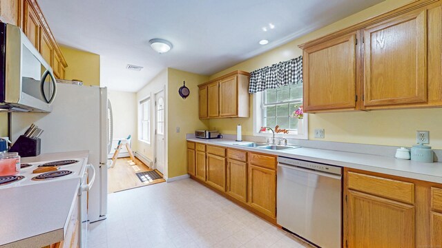 19 Heritage Brook Dr, East Haddam, CT 06423 - kitchen featuring stainless steel appliances, a sink, light flooring, light countertops, and healthy amount of natural light