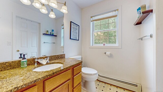 19 Heritage Brook Dr, East Haddam, CT 06423 - bathroom with baseboard heating, toilet, and vanity