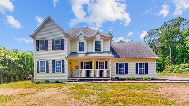 19 Heritage Brook Dr, East Haddam, CT 06423 - view of front of house featuring covered porch, a front yard, cooling unit, and a shingled roof