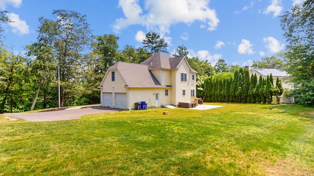 19 Heritage Brook Dr, East Haddam, CT 06423 - rear view of property with a yard, asphalt driveway, and roof with shingles