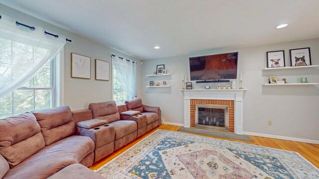 19 Heritage Brook Dr, East Haddam, CT 06423 - living area featuring plenty of natural light, a fireplace, wood finished floors, and recessed lighting