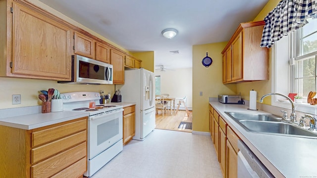 19 Heritage Brook Dr, East Haddam, CT 06423 - kitchen with white appliances, a sink, light countertops, and a ceiling fan