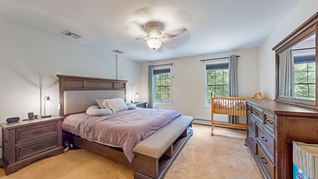 19 Heritage Brook Dr, East Haddam, CT 06423 - bedroom with light carpet and a baseboard heating unit