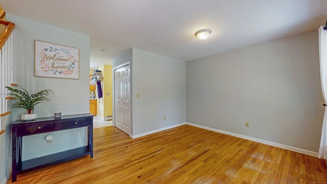 19 Heritage Brook Dr, East Haddam, CT 06423 - spare room featuring light wood-type flooring, baseboards, and a baseboard radiator