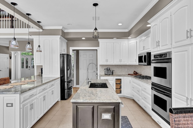 18 Cedar Spring Rd, Burlington, CT 06013 - kitchen featuring appliances with stainless steel finishes, a sink, light tile patterned floors, white cabinetry, and crown molding