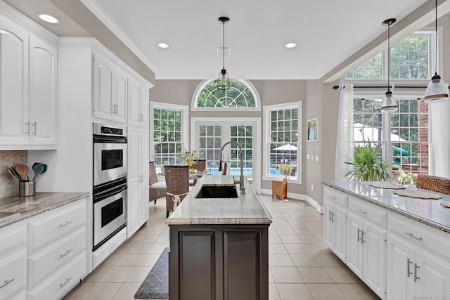 18 Cedar Spring Rd, Burlington, CT 06013 - kitchen with a sink, stainless steel double oven, light tile patterned floors, a center island with sink, and recessed lighting